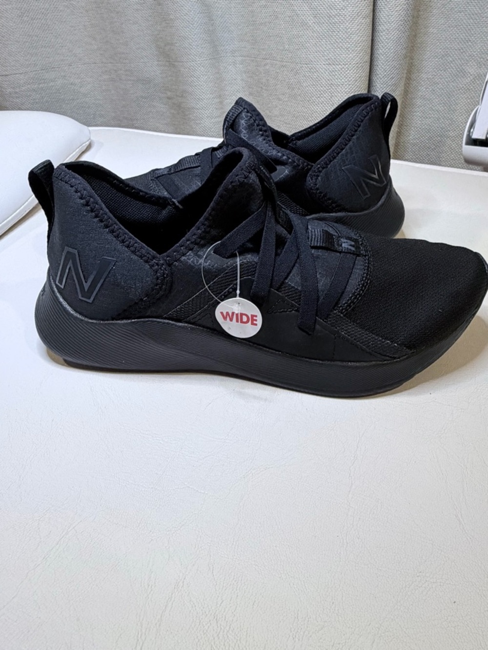 New Balance women’s Black Slip-On Knit Sneakers